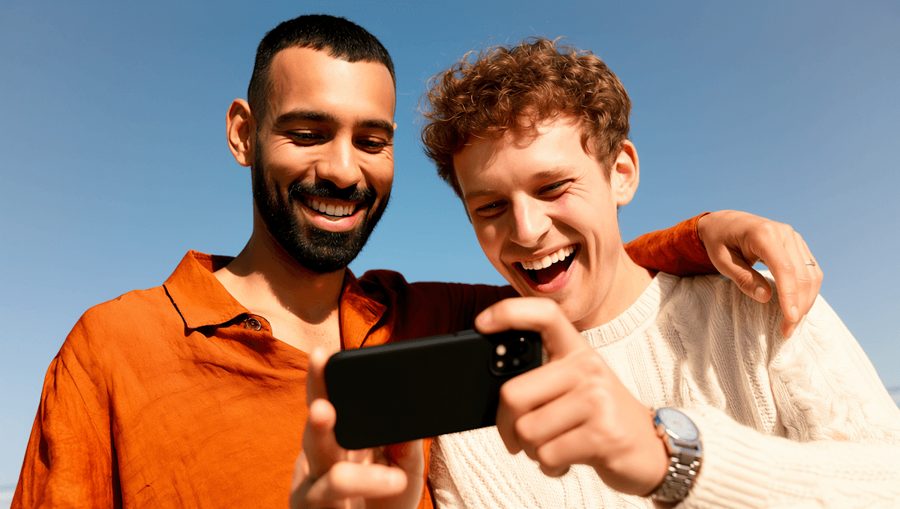 Two friends looking at a phone together