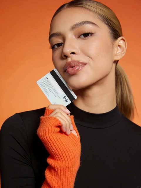 Woman holding a bank card
